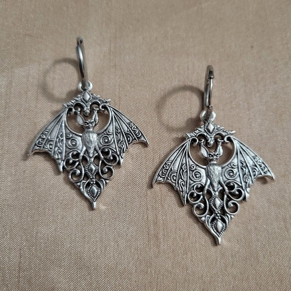 Gothic bat shaped filigree silver tone earrings